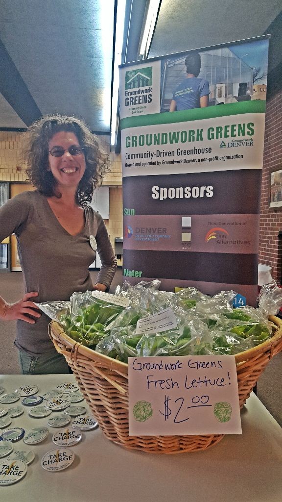 emily with greens and gh sign
